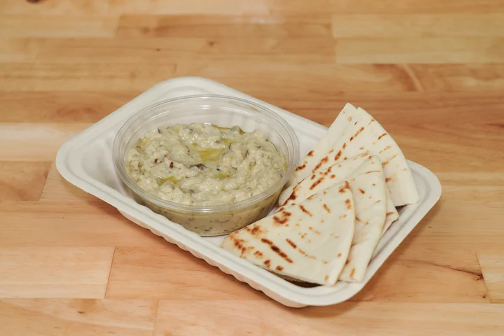 Fire-roasted eggplant dip with warm grilled pita wedges.